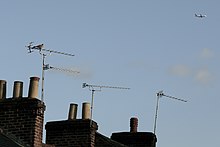 Chimney-mounted aerials used for receiving terrestrial television. These ones are Yagi-Uda antennae. Television aerials mounted on chimneys.jpg