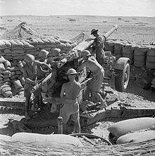 British gunners cleaning a 3.7-inch anti-aircraft gun near Tobruk, 19 August 1941 The British Army in North Africa 1941 E4946.jpg
