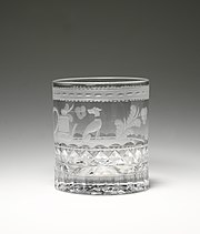 cut glass with engraving of a dog and plants