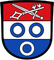 Gemeinde Hollenbach Zweimal geteilt von Rot, Silber und Blau; 1: schräg gekreuzt ein silbernes Schwert und ein silberner Schlüssel; 2 und 3: drei zwei zu eins gestellte Ringe in verwechselten Farben.