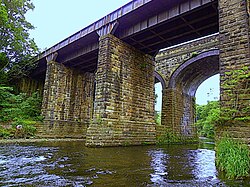 Stone railway viaducts straddling a river