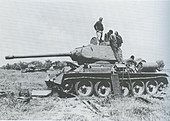 Somali engineers repair a captured Ethiopian T-34/85 Model 1969 tank for use by the Western Somali Liberation Front during the Ogaden War, March 1978 Damagedsomalitank.jgp.jpg