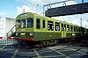 Electric multiple units 8106 and 8306 at the level crossing at Bray in 1993