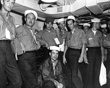 Freed U.S. POWs in World War II-era dungarees (1945) Dungarees Reeves.jpg