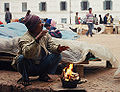 A seller warming himself up in Durbar Square, Kathmandu, Nepal (pre-prohibition)