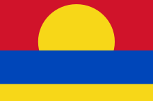 Flag of Palmyra Atoll, having red, blue, and yellow horizontal stripes of decreasing height, with the upper majority of a yellow circle at the bottom center of the red stripe