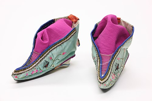 A pair of Chinese shoes from 1911 made for feet that have been bound in the Chinese foot binding custom.