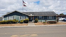 photo of district office with Redwood Elementary School in background
