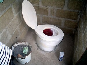 A locally-made toilet seat in Haiti. Note the ...