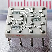 Closeup shows the raised squares of the transistors and the flat black resistors