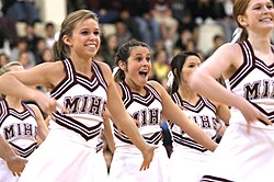 High school cheerleaders. Whether cheerleading constitutes an actual sport is a major source of contention in the U.S. Mercer Island High School Cheerleaders.jpg