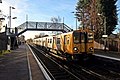 A Merseyrail Class 507 waits at the Ormskirk-bound platform.