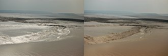 Effect of a polarizer on reflection from mud flats. In the picture on the left, the horizontally oriented polarizer preferentially transmits those reflections; rotating the polarizer by 90deg (right) as one would view using polarized sunglasses blocks almost all specularly reflected sunlight. Mudflats-polariser.jpg