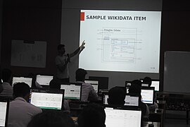Ambadi explaining the Wikidata structure.