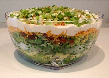 Seven-layer salad is an American dish that inc...