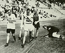 A track-side judge monitoring technique at the 1912 Summer Olympics in Stockholm, Sweden 1912 Athletics men's 10 kilometre walk.JPG