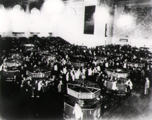 The trading floor of the New York Stock Exchange Building in 1930, six months after the Crash of 1929 1930-67B.png