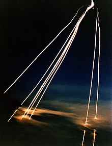 A time exposure of eight Peacekeeper (LGM-118A) intercontinental ballistic missile reentry vehicles passing through clouds while approaching an open-ocean impact zone during a flight test DF-SC-84-11662.jpg