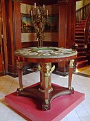 Empire style table with caryatids en gaine supported by bare feet, in the Musée Dufresne-Nincheri (Montreal, Canada)
