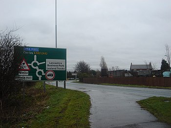 English: Sign for double roundabout at Faringt...