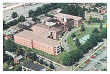 A bird's eye view of a large, U-shaped brick building that is Phoebe Ministries' Allentown Campus.