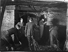 Bevin Boys receiving training from an experienced miner at Ollerton, Nottinghamshire, February 1945 Bevin Boy- Mining Training at Ollerton, Nottinghamshire, February 1945 D23736.jpg
