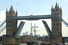 The tall ship Wylde Swan passing under Tower Bridge decorated for the London Olympics in August 2012. Note the Olympic rings are folded up to allow passage of the mast. Cmglee Tower Bridge tall ship.jpg