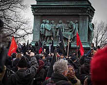 Black bloc anarchist protest in Washington, D.C., on J20 on a Civil War monument. Inauguration Day Marchers.jpg