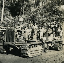 Caterpillar tractor on the Kasim-Sele road used for oil and gas exploration in the 1930s KITLV A1042 - Caterpillar tractor op de weg van Kasim naar Sele bij Salawati in West-Nieuw-Guinea, KITLV 140548.tiff