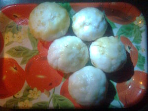 English: Pitha made from rice flour with cocnu...