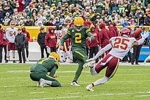 Crosby kicking a field goal during a game