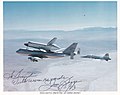 Photography of space shuttle orbiter and 747 carrier aircraft signed by Jim Beggs.