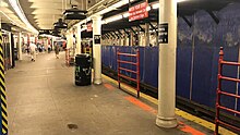 The Times Square station starting a renovation project; the platform is covered by blue construction walls Times Square Renovation Blue walls.jpg
