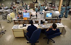 US Navy 030423-N-6967M-090 A central computer system monitors the heart rates of each patient in the Intensive Care Unit (ICU) to ensure a quick