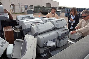San Diego (May 13, 2010) Workers gather printe...