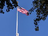 “This Flag Pole dedicated to the Village of East Hampton in memory of George Lodowick McAlpin, 1856-1922, by members of his family, July 4, 1926.” — Plaque.