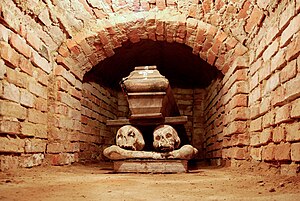 Coffin in a brick-lined crypt under the church...