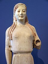 Peplos Kore at the Acropolis Museum. Relics of the polychromy are visible. ACMA 679 Kore 2.JPG