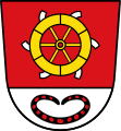 Gemeinde Rommelsried Über silbernem Schildfuß, darin ein roter Ring (Bronzering), in Rot das goldene Katharinenrad.
