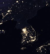 The Korean Peninsula at night, shown in a 2017 composite photograph from NASA Korean Peninsula at night from space.jpg