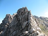 Felskopf mit Eisenklammern beim Übergang vom Dritten zum Zweiten Schafalpenkopf