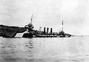 USS Beale (DD-40) moored to a buoy at Queenstown, Ireland, in 1918. She is painted in pattern camouflage.