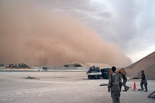 US Navy 070521-N-0000X-021 Sailors prepare to take cover as a sandstorm engulfs the Hardened Aircraft Shelter at Al Asad Air Base, Iraq.jpg