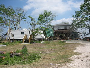 FEMA trailer and Katrina damaged house in St. ...