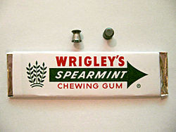 A .177 (4.5mm) caliber "Wadcutter" pellet next to a stick of chewing gum 177cal.jpg