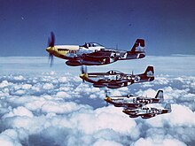 P-51 Mustangs in flight, summer 1944. Unlike the Spitfire, the P-51 could "clear the path" for the USAAF bombers to reach their targets. Their presence would break the Luftwaffe in 1944-45 Bott4.jpg