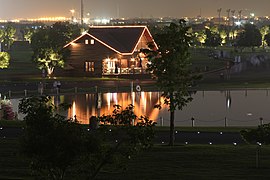 The Cottage overlooking Aspire Lake at nighttime
