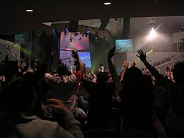 A Pentecostal worship service at Dream City Church, affiliated with the Assemblies of God USA, in 2007, in Phoenix, United States Dream City Church worship2.jpg