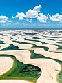 Image 10 Lençóis Maranhenses National Park Photograph: Julius Dadalti Lençóis Maranhenses National Park (Parque Nacional dos Lençóis Maranhenses) is a national park located in Maranhão state, in northeastern Brazil, just east of the Baía de São José. Protected since June 1981, the 383,000-acre (155,000 ha) park includes 70 km (43 mi) of coastline, and an interior of rolling sand dunes. During the rainy season, the valleys among the dunes fill with freshwater lagoons, prevented from draining due to the impermeable rock beneath. The park is home to a range of species, including four listed as endangered, and has become a popular destination for ecotourists. More selected pictures