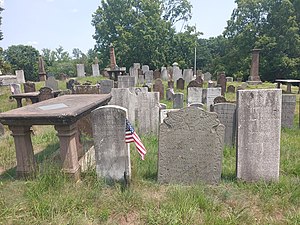 View of gravestones and brownstone table marker